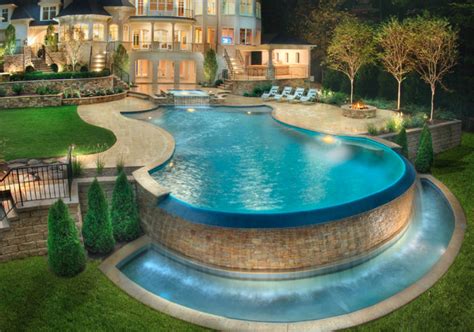 An in-ground pool is a water-filled recreational or exercise fixture built permanently into the ground with the top sitting flush with the lawn. . Best backyard pool